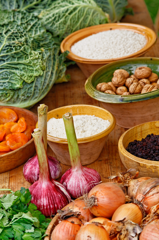 Close-up image of a wooden table full of natural food ingredients.